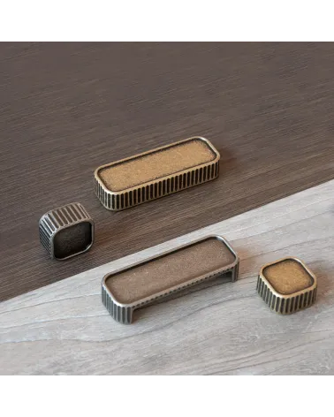 WEGA furniture handle designer handle placed on a wooden plate