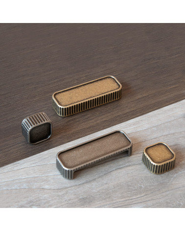 WEGA furniture handle designer handle placed on a wooden plate
