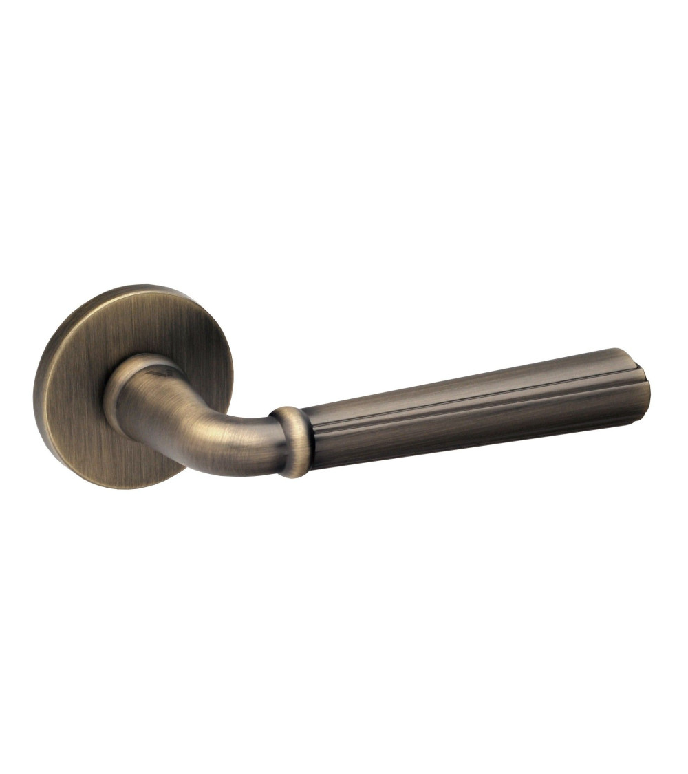 Retro CASCADA door handle on round plate - designer handle