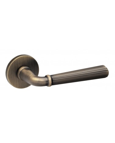 Retro CASCADA door handle on round plate - designer handle