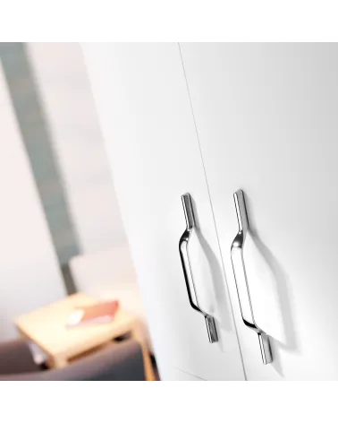 Polished chrome furniture handle GOLDEN design handle mounted on a white unit