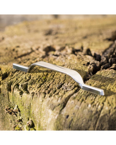 GOLDEN furniture handle design handle colour 1 highlighted on a wooden log