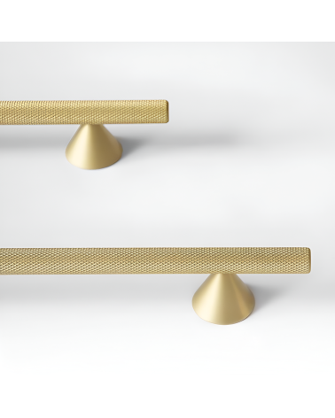 ONDIN design furniture handle in gold anode/matt gold arranged on a white surface