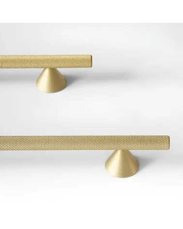 ONDIN design furniture handle in gold anode/matt gold arranged on a white surface