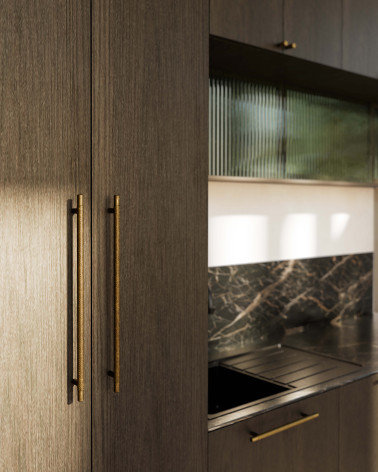 VENDÉ design furniture handle in patinated brass side view mounted on wooden furniture