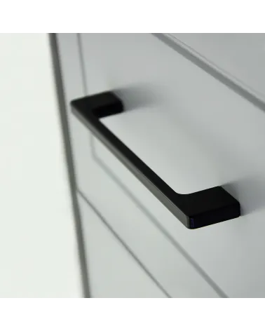 TECHNO design furniture handle in matt black, close-up view on a drawer