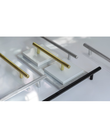 CRUSO furniture handle designer handle displayed on plates