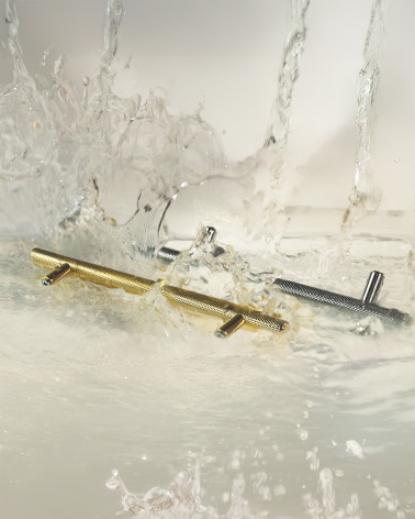 CRUSO furniture handle designer handle displayed in a splashing water scene