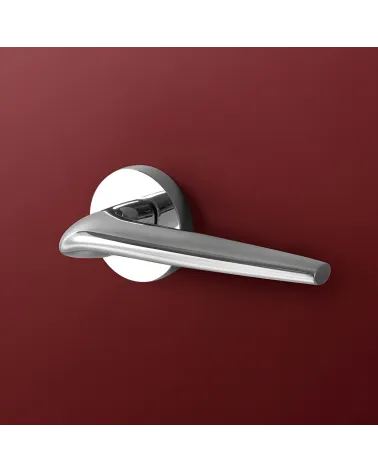 Polished chrome JULIA door handle design handle highlighted on a plain background
