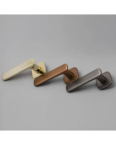 FLOW door handle design handle presented on a grey surface