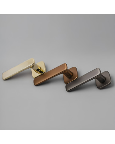 FLOW door handle design handle presented on a grey surface