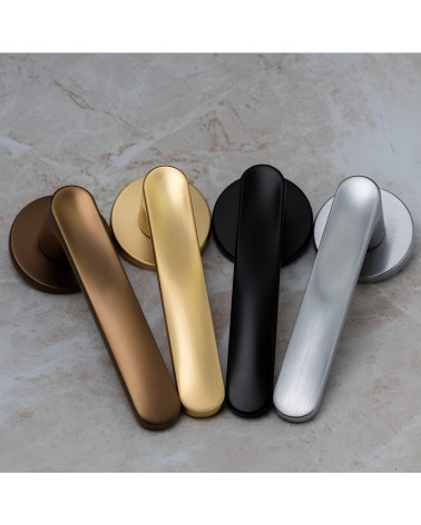 RITA door handle design handle presented on a grey surface