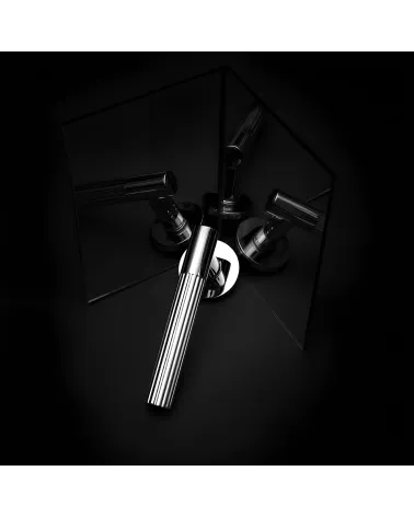 Polished chrome LIVIA door handle designer handle presented with mirror reflections