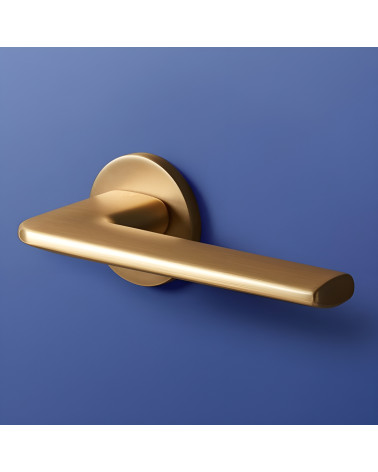 Satin gold ANDREA door handle design handle on blue background