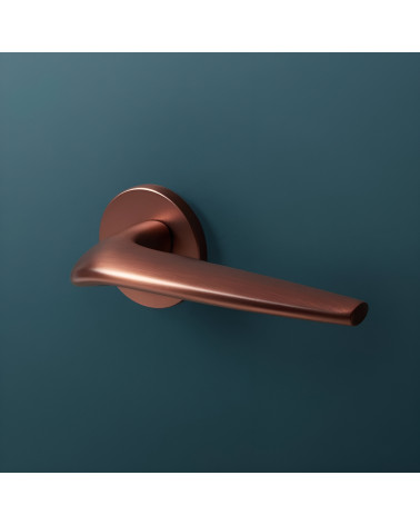 JULIA copper door handle design handle on blue background