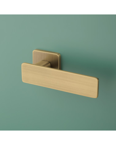 NOEMIA designer door handle in matt antique patina finish angled view