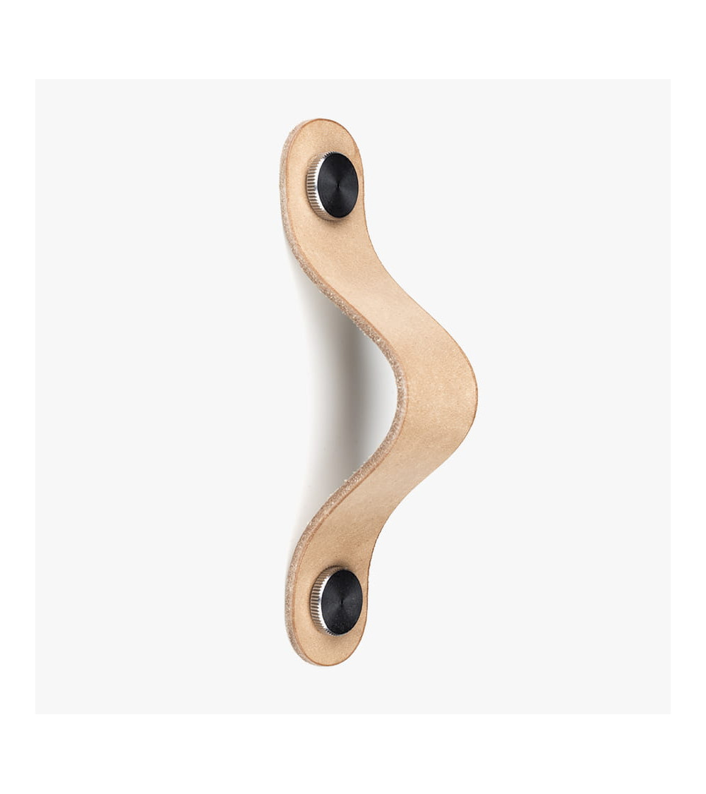 Furniture handle in light leather