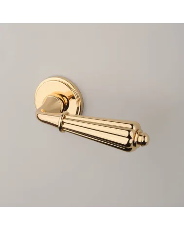 LIMONA design door handle in polished gold, angled top view