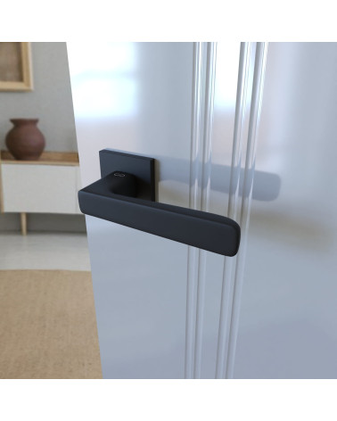 Black PARMA design door handle fitted on an open door