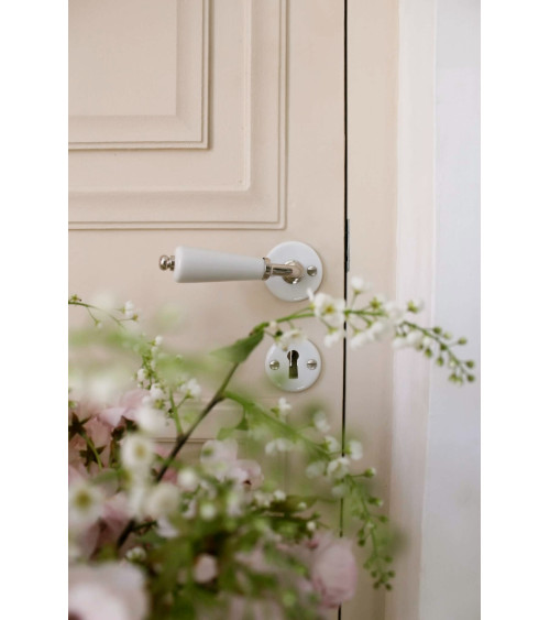 Barrel door handle on white porcelain rose - nickel finish - designer handle
