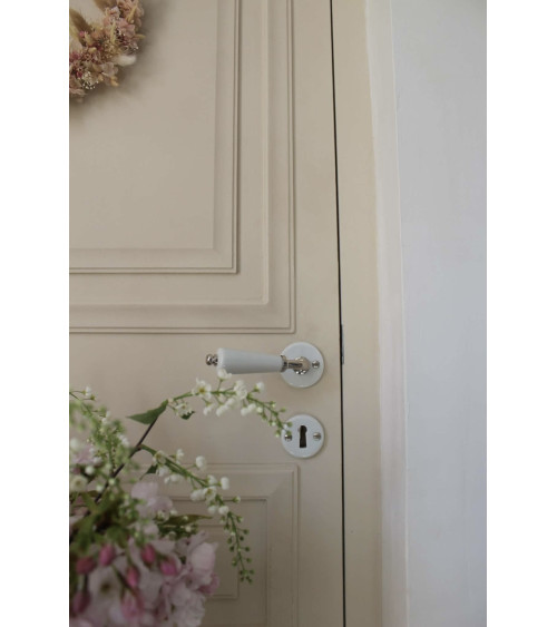 Barrel door handle on white porcelain rose - nickel finish - designer handle