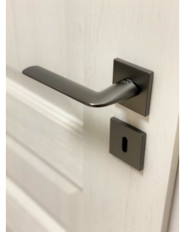 STINGER titanium door handle design handle angled top view mounted on a door