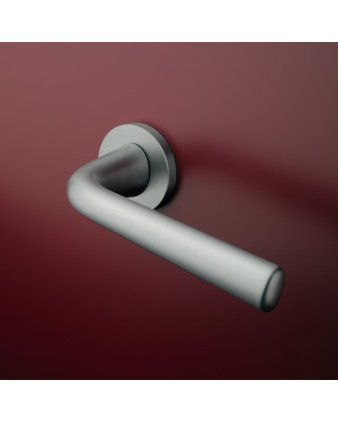 Satin chrome TULIPA interior door handle design mounted on a door