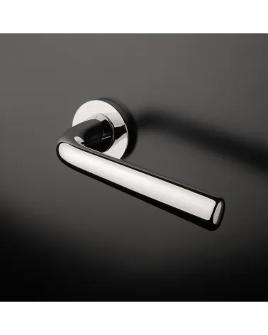 Polished chrome TULIPA interior door handle design mounted on a door