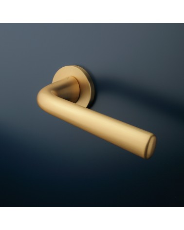 Matt gold TULIPA door handle interior door design mounted on a door