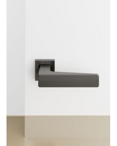 Mandelli Virgo modern door handle design handle colour 3 placed on a background