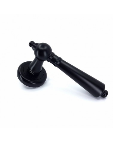Black MILLENAIRE door handle designer handle profile view mounted on a door