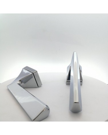 Polished chrome Impera door handle design handle close-up view fitted on a plate