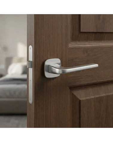Door handle on rounded backplate brushed chrome finish Solo