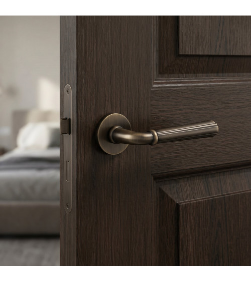 Retro CASCADA door handle on round plate - designer handle