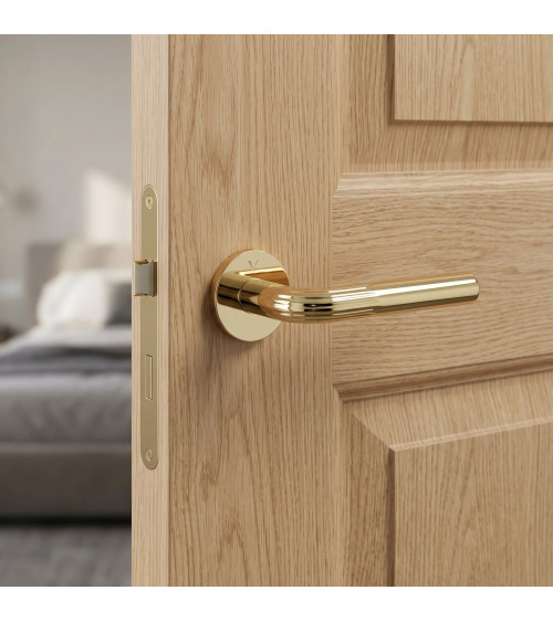 Polished brass Frella door handle designer handle