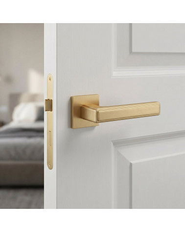 FRESIA door handle in satin gold finish
