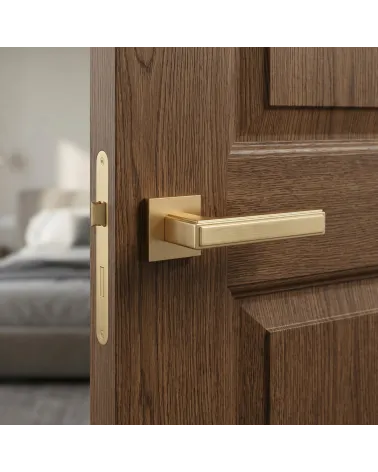 FRESIA door handle in satin gold finish