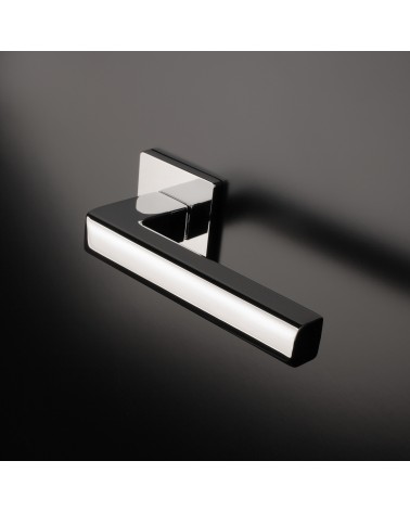 SALICE polished chrome door handle designer hardware mounted on a door