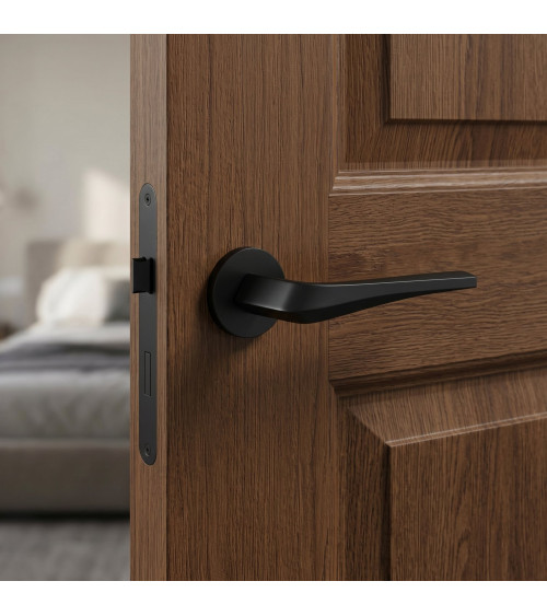 FLOW matt black door handle on round plate - designer handle