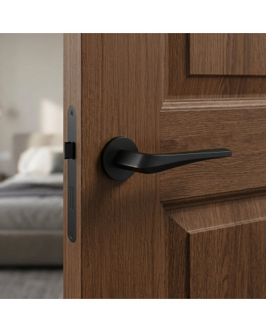 Matt black FLOW door handle on round backplate