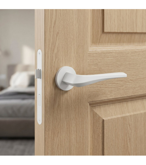 Matt white FLOW door handle on round rosette - designer handle