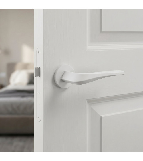 Matt white FLOW door handle on round rosette - designer handle