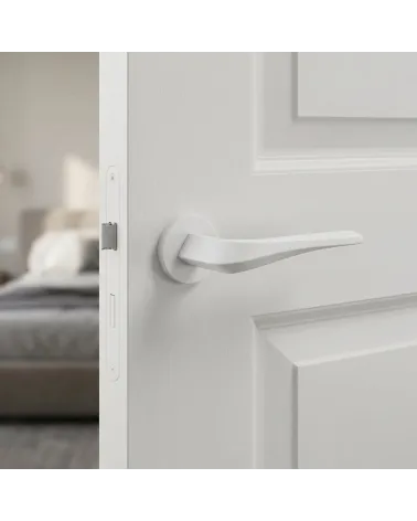 Matt white FLOW door handle on round backplate
