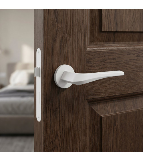 Matt white FLOW door handle on round rosette - designer handle