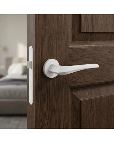 Matt white FLOW door handle on round backplate
