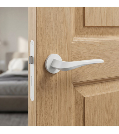 Matt white FLOW door handle on round rosette - designer handle