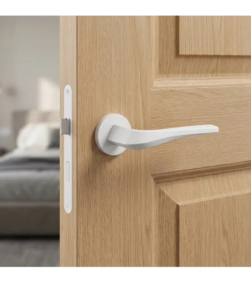 Matt white FLOW door handle on round rosette - designer handle
