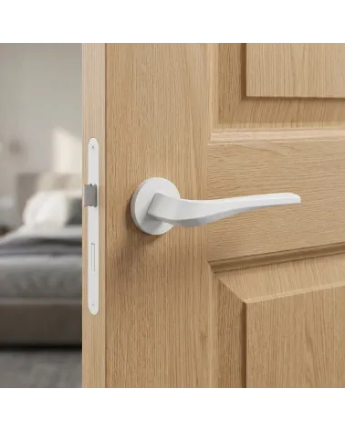 Matt white FLOW door handle on round backplate