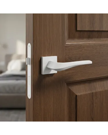 Matt white FLOW door handle on square backplate