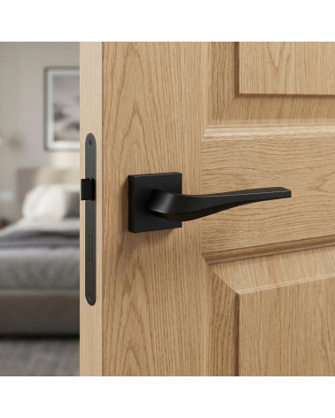 Matt black FLOW door handle on square backplate